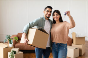 Down Payment Assistance happy couple showing keys of their apartment
